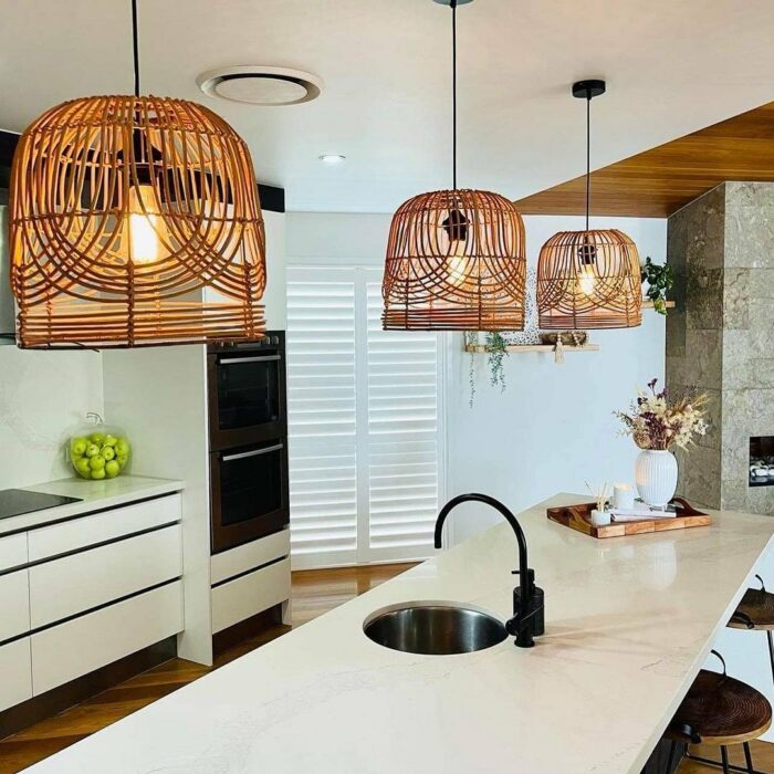 Kitchen with white table and lampshade pendants