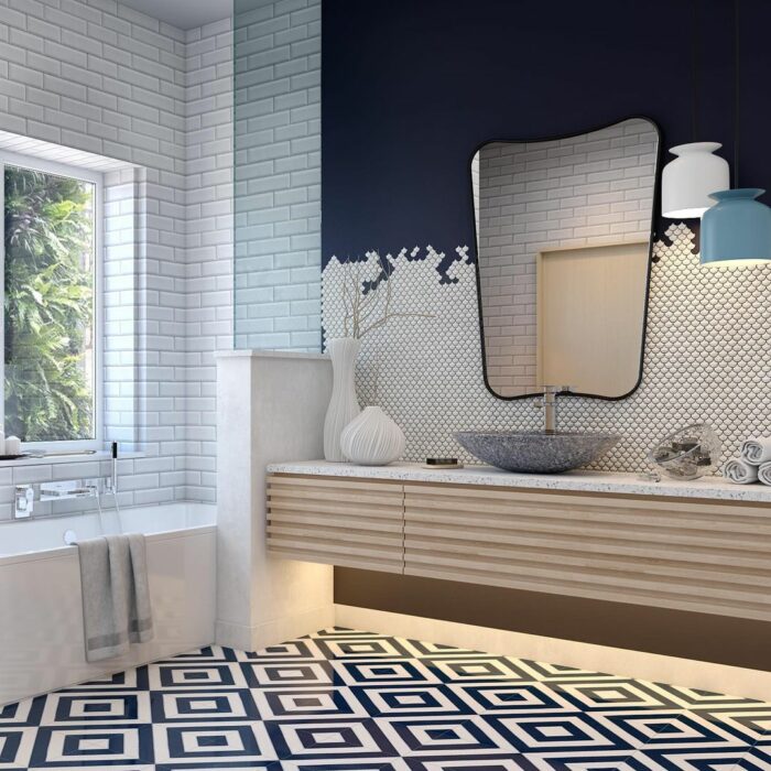 Bathroom with a sink, mirror, and navy and white wallpaper with a tiled effect 