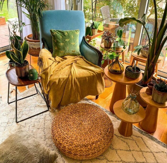 a maximalist small room with a chair surrounded by houseplants