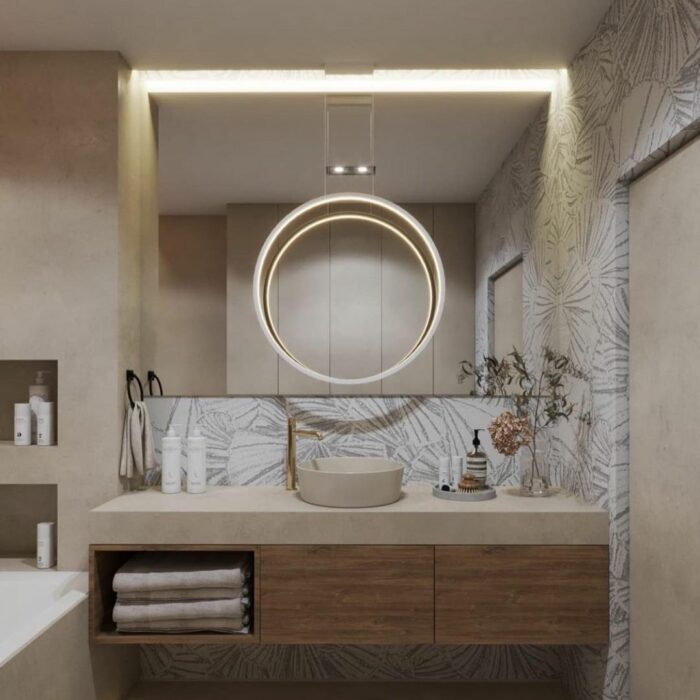 Modern bathroom featuring waterproof wallpaper with subtle leaf pattern and wooden cupboard with sink and circular light fixture. Modern bathroom featuring waterproof wallpaper with subtle leaf pattern and wooden cupboard with sink and circular light fixture.