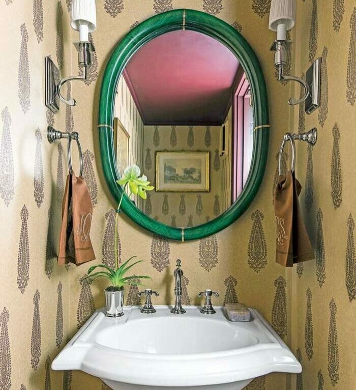 Bathroom with brown wallpaper and sink