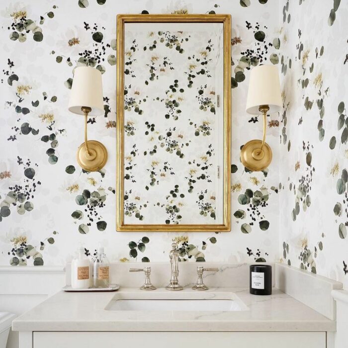 Bathroom with minimalist flower wallpaper and marble sink