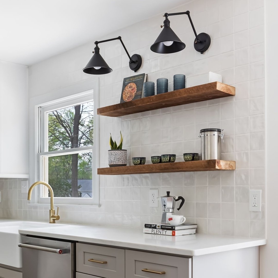 White kitchen with cupboards and arm lights