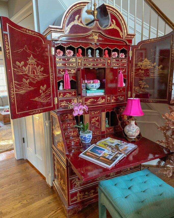 a maximalist red cabinet of curiosities