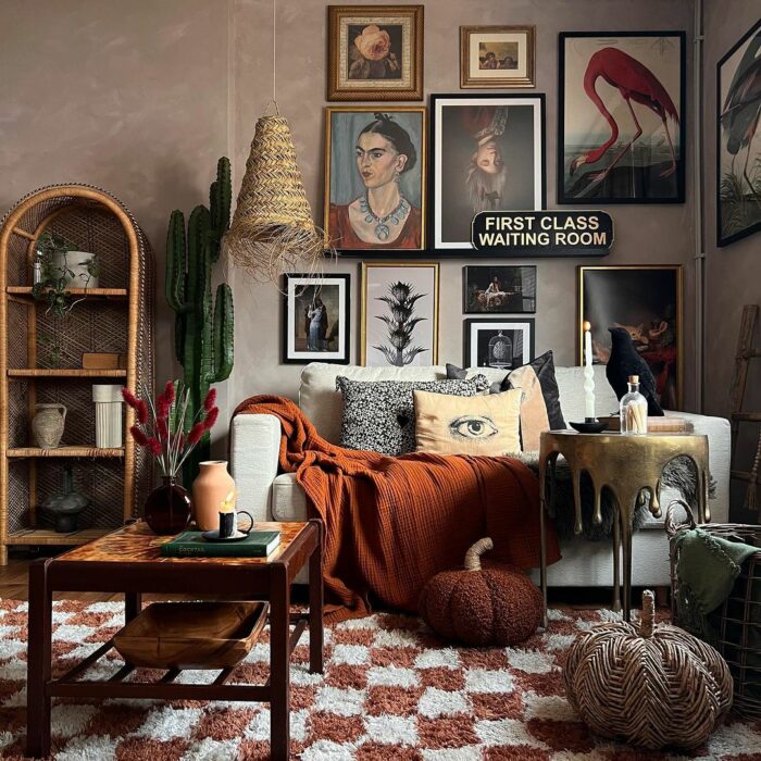 a maximalist living room with paintings on the wall