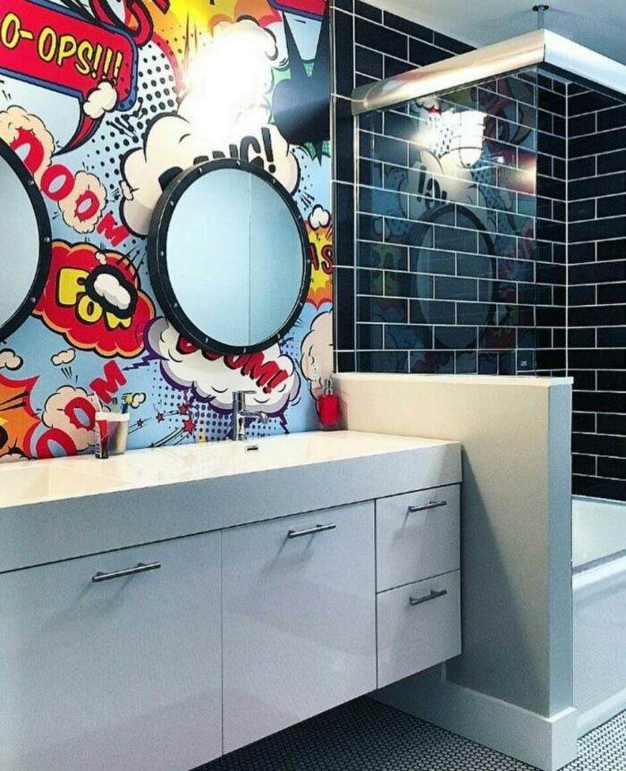 Bathroom featuring trendy graphic comic wallpaper with a white cupboard and sink to elevate your space. Bathroom featuring trendy graphic comic wallpaper with a white cupboard and sink to elevate your space.
