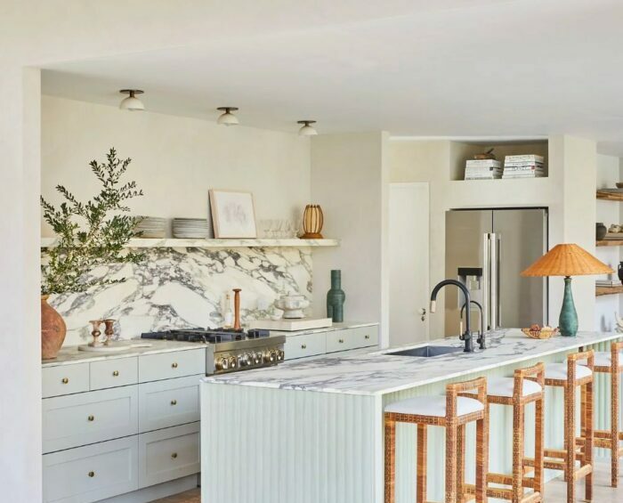 White kitchen with furniture lamps and marble table with chairs White kitchen with furniture lamps and marble table with chairs