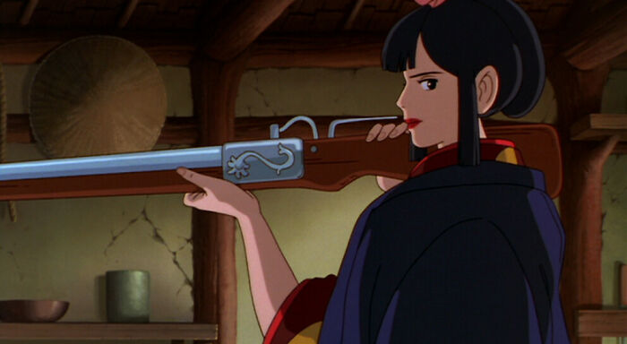Lady Eboshi from Princess Mononoke holding a gun