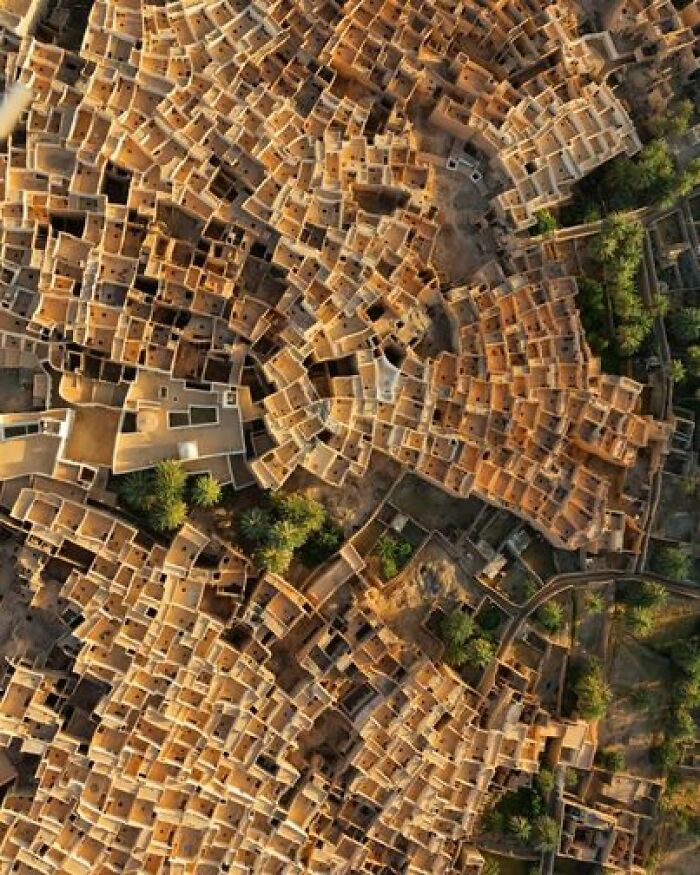 From A Vantage Point High Above, Behold The Captivating Ghadames, An Oasis Town With Deep Roots In Pre-Roman Amazigh Culture, Nestled In The Vast Sahara Of Libya. Time Has Gracefully Preserved The Charm Of This Ancient Settlement, Characterized By Tightly Clustered Traditional Mud-Brick-And-Palm Houses That Have Withstood The Test Of Centuries