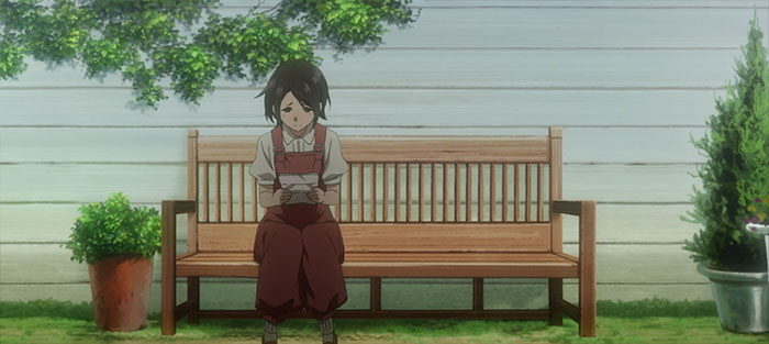 Ann sitting on a bench and reading a letter