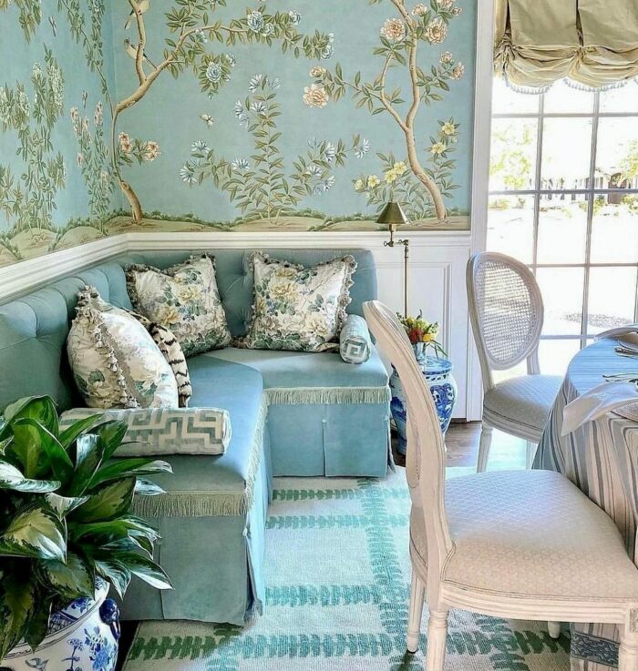Blue banquette with blue branches with nature wallpaper wall