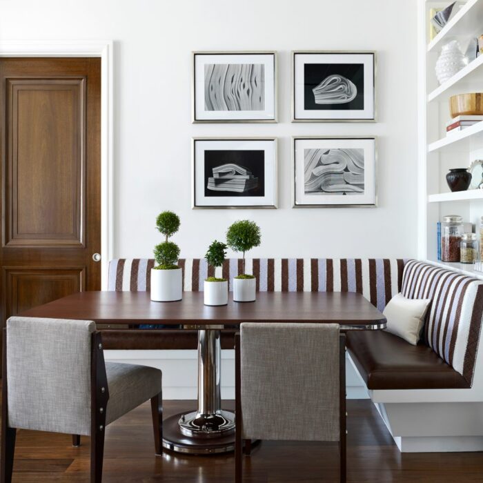 Brown patterned banquette with wooden table and chairs