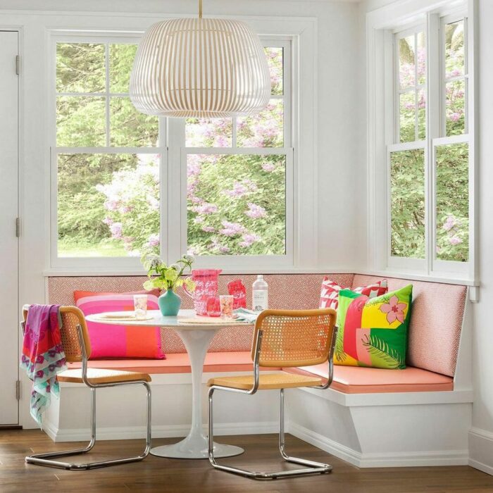 White pink banquette with table and chairs