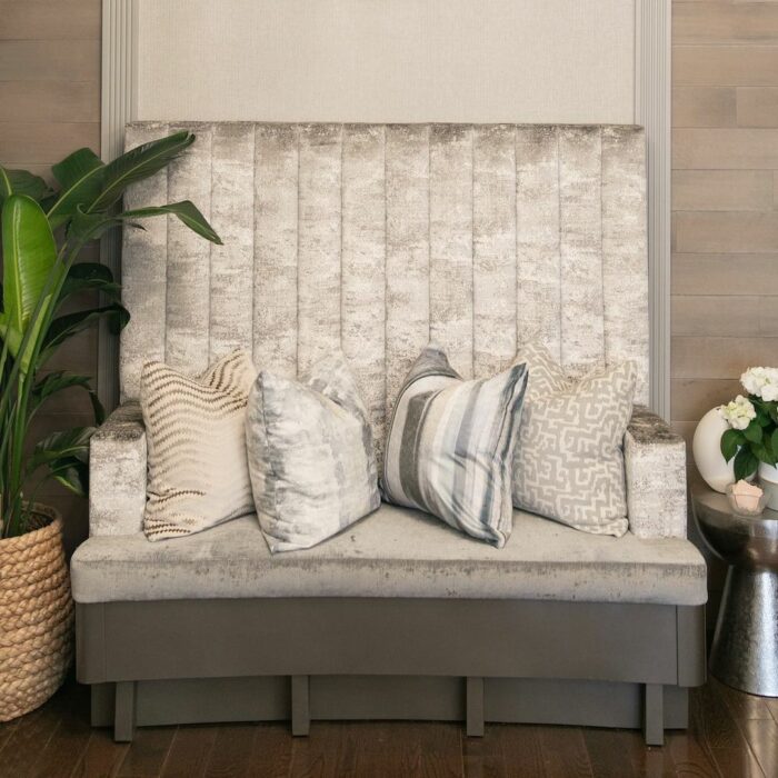 Gray banquette with pillows