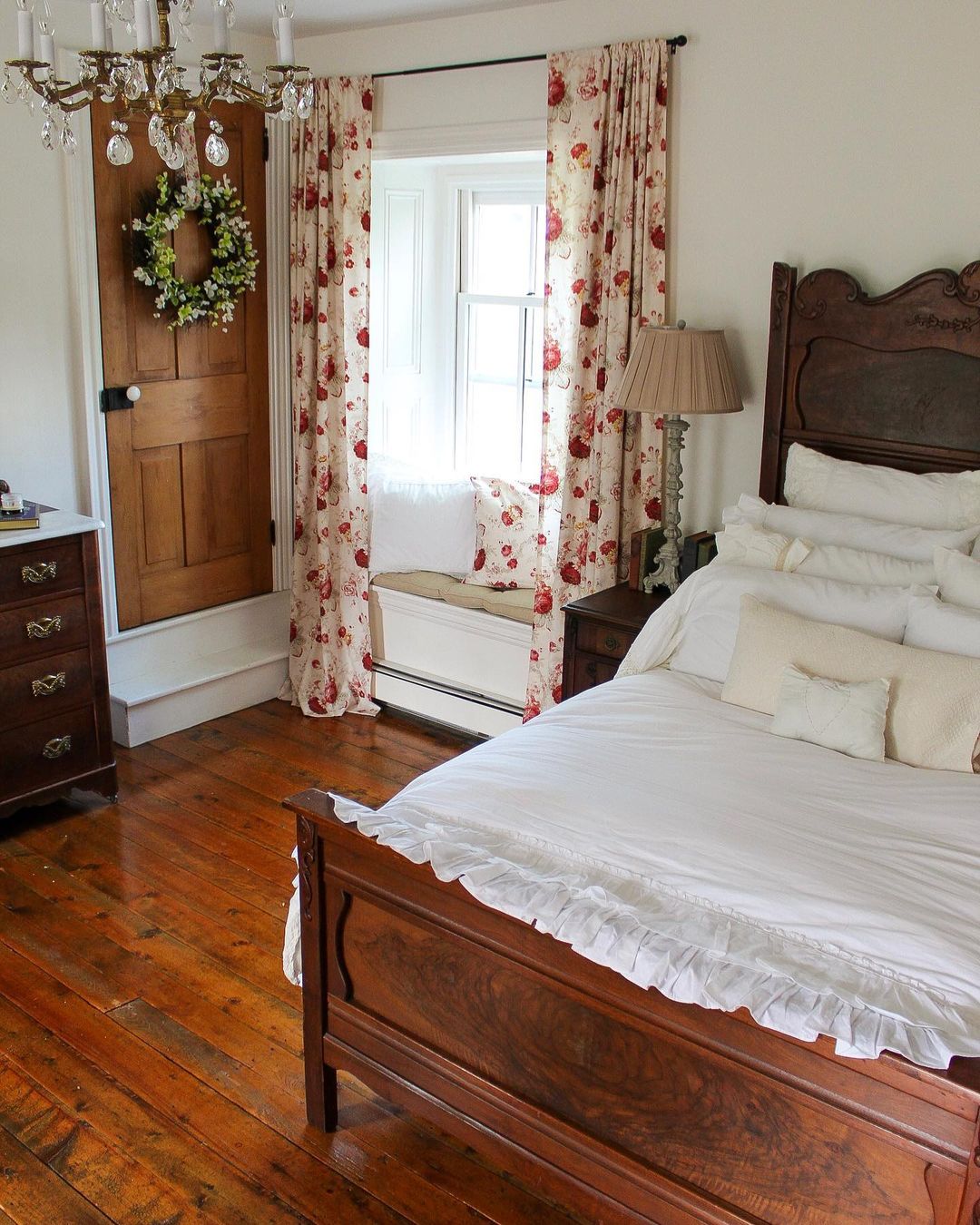 wooden bed near the window with floral curtains wooden bed near the window with floral curtains