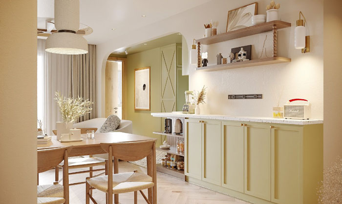 A green kitchen cabinets and wooden shelves above it 