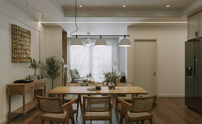 Wooden dining table with small vase and chairs showcasing unique boho decor ideas for a chic living space. Wooden dining table with small vase and chairs showcasing unique boho decor ideas for a chic living space.
