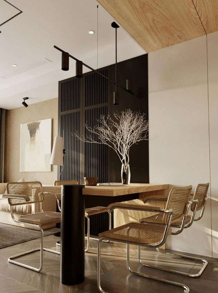 Dining area featuring boho decor with a wooden table, woven chairs, and a minimalist vase centerpiece for a chic space. Dining area featuring boho decor with a wooden table, woven chairs, and a minimalist vase centerpiece for a chic space.