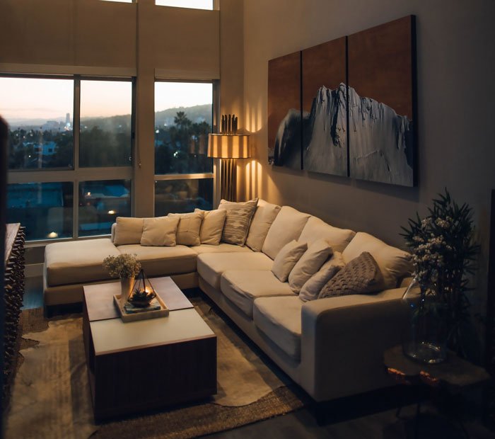 Deep off white L-shaped sofa in cozy living room setting, showcasing a budget-friendly cheap couch option. Deep off white L-shaped sofa in cozy living room setting, showcasing a budget-friendly cheap couch option.