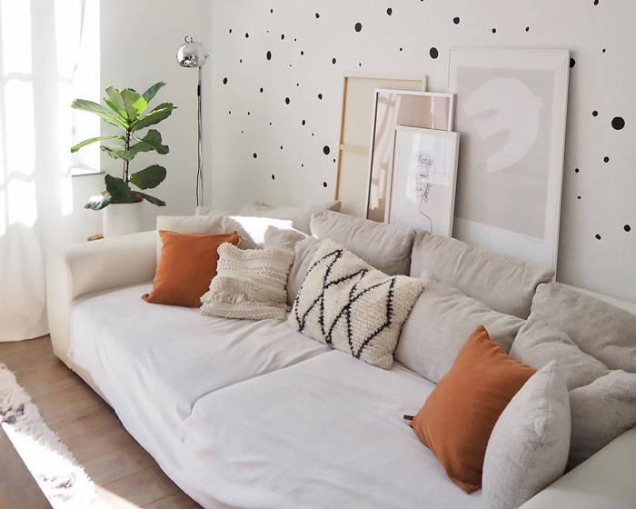 Bright soft sleeper couch with multiple throw pillows in a cozy living space, showcasing cheap couches for budget-friendly decor. Bright soft sleeper couch with multiple throw pillows in a cozy living space, showcasing cheap couches for budget-friendly decor.