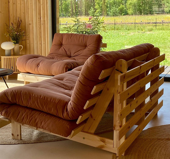 Two brown trifold futon sofas 