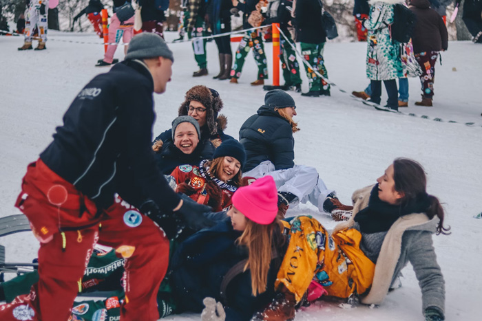 People smiling and having fun in the snow in Helsinki, Finland