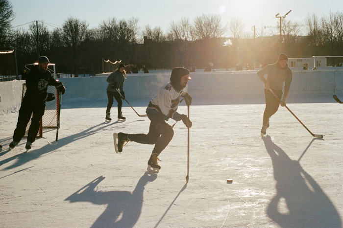 A group of people playing hockey outside in Montréal, QC, Canada