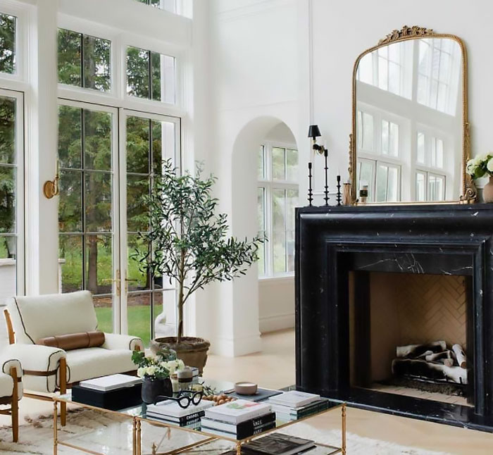 Modern living room fireplace with black marble mantle