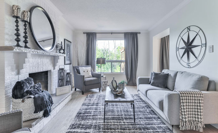 White living room featuring a white painted fireplace mantel with modern decor and cozy seating arrangements. White living room featuring a white painted fireplace mantel with modern decor and cozy seating arrangements.