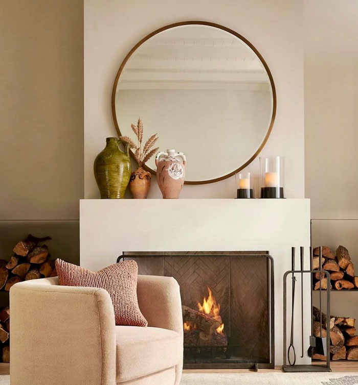 natural colour living room with simple fireplace and simple design vases on the mantle