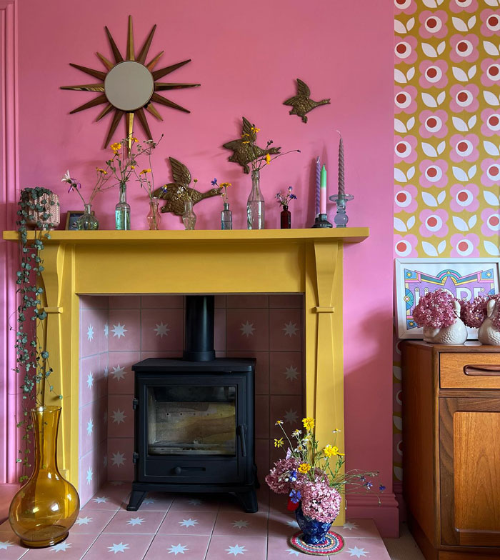 colorful living room fireplace with a painted yellow mantel