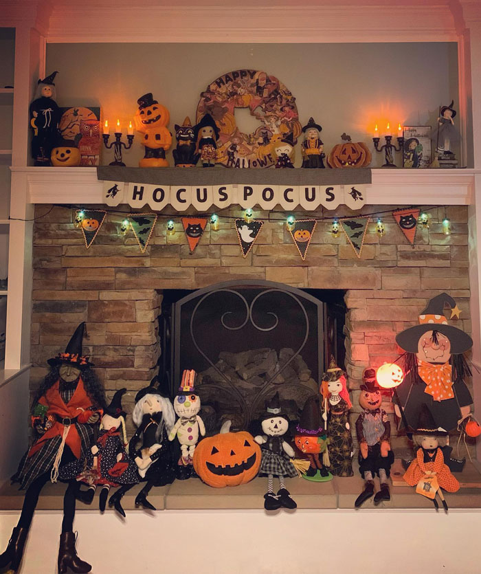 Stone brick fireplace with halloween decoration display