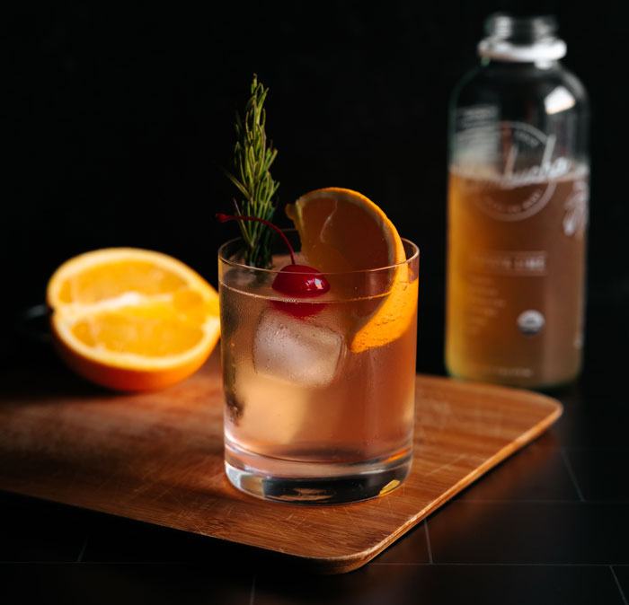 Cocktail with ice cherry and orange 