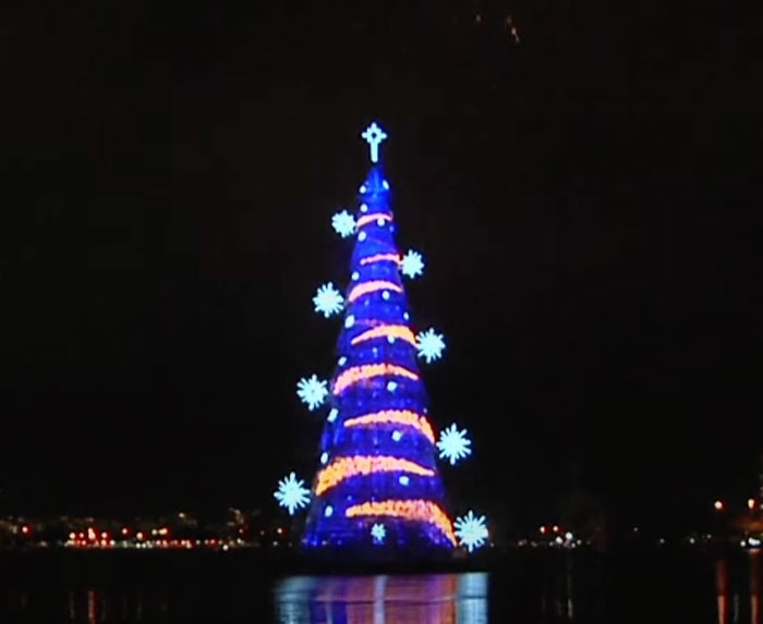 Floating Christmas tree with blue and yellow lightenings 