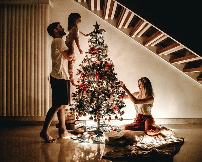 Family decorating Christmas tree 