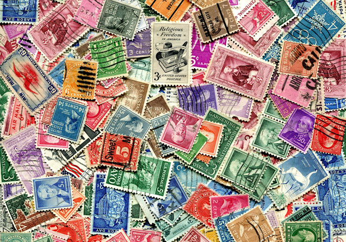 A pile of different postage stamps 