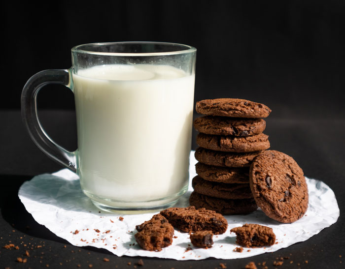 Cookies and milk in the glass cup 