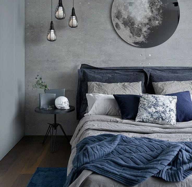 Big bed in gray colors with pillows