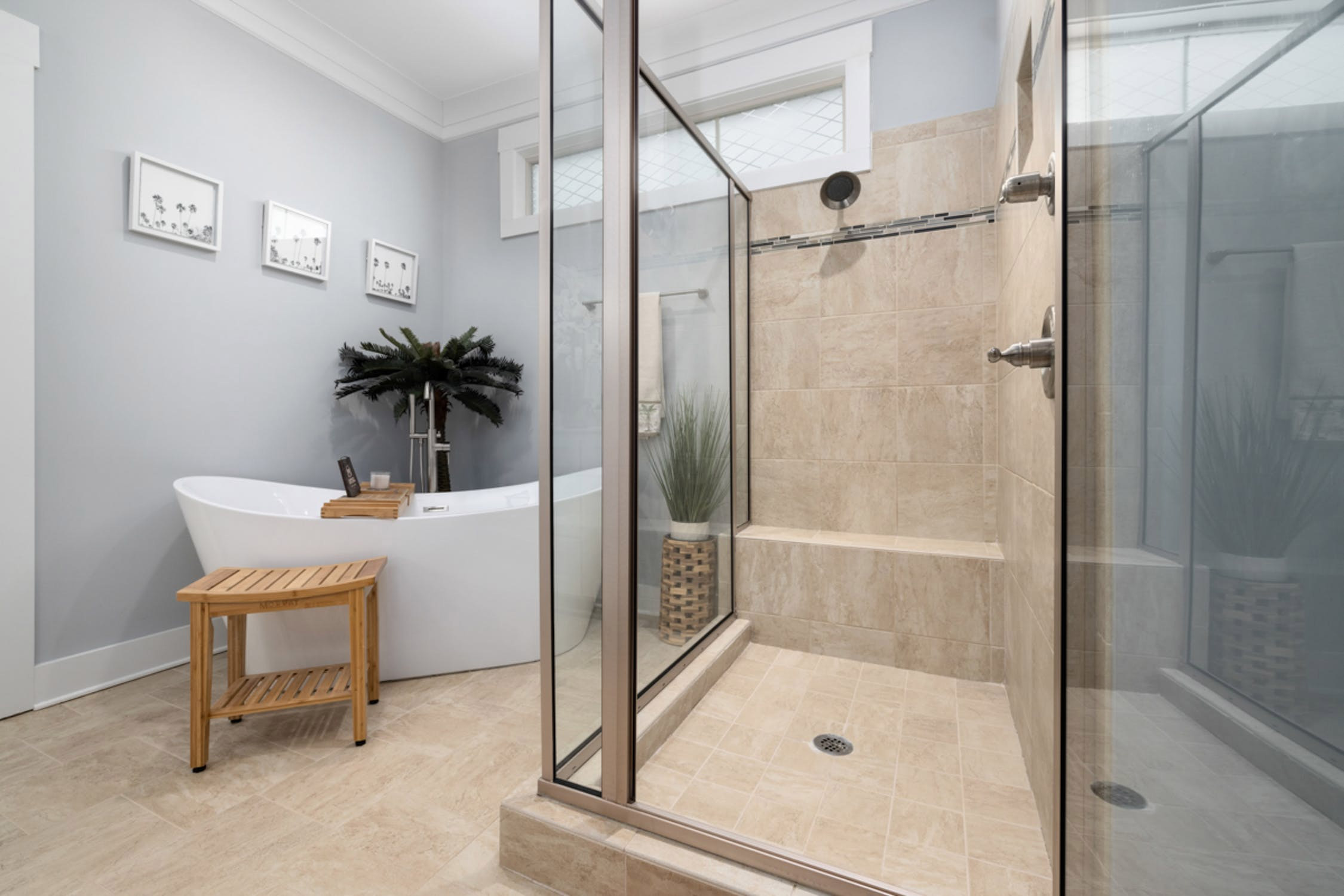 White bath near glass shower