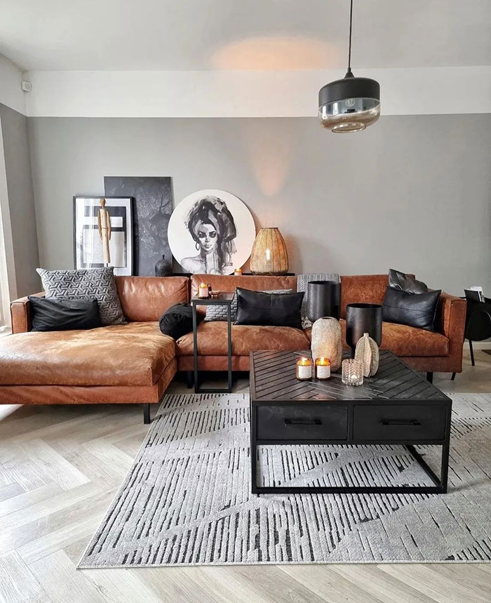 Modern living room with brown accent details, black cushions, contemporary art, and stylish home decor ideas for a cozy space. Modern living room with brown accent details, black cushions, contemporary art, and stylish home decor ideas for a cozy space.