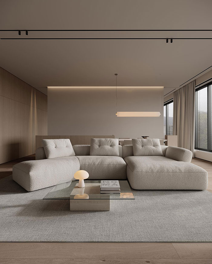 Spacious minimalistic living room with modern beige sofa and glass coffee table showcasing home decor ideas and designer insights. Spacious minimalistic living room with modern beige sofa and glass coffee table showcasing home decor ideas and designer insights.