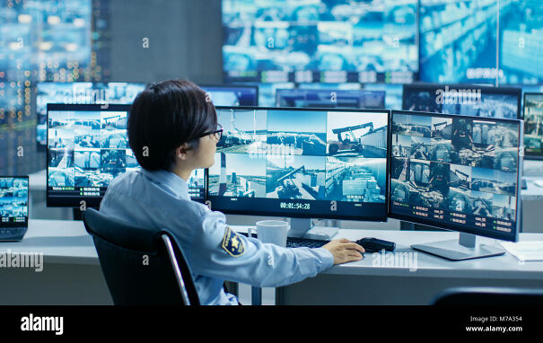 in-the-security-control-room-officer-monitors-multiple-screens-for-M7A354-6518444f96547.jpg