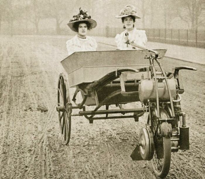 Two Young Ladies Driving And Riding In A Lawson’s Motor Wheel Of 1902