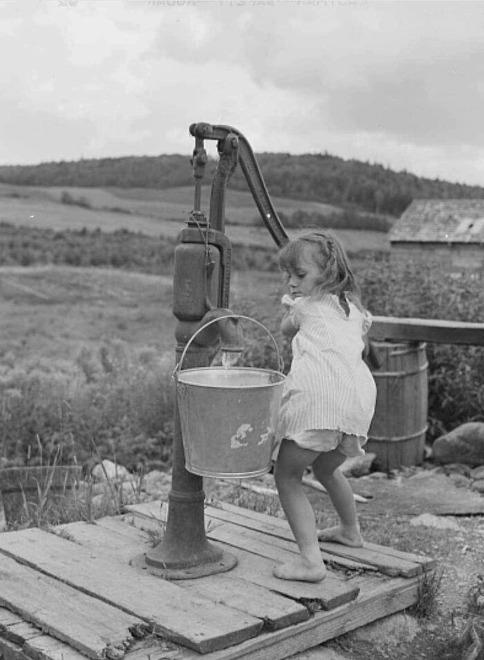 Little Girl Getting Water At The Farm, Maine, 1942