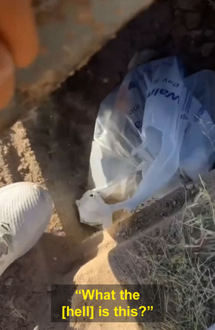 Person Goes Viral After Finding A "Sketchy" Stash Of Money Buried In The Sand