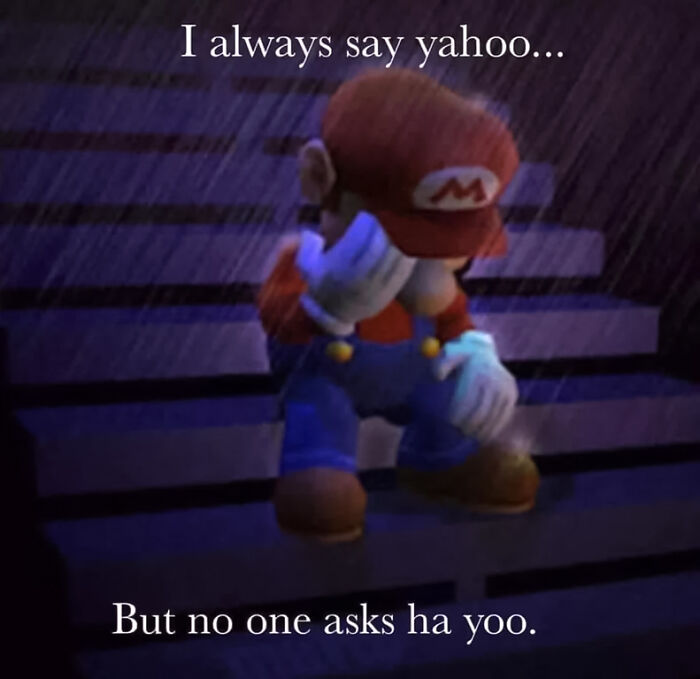 Mario sadly sits on stairs in a rain