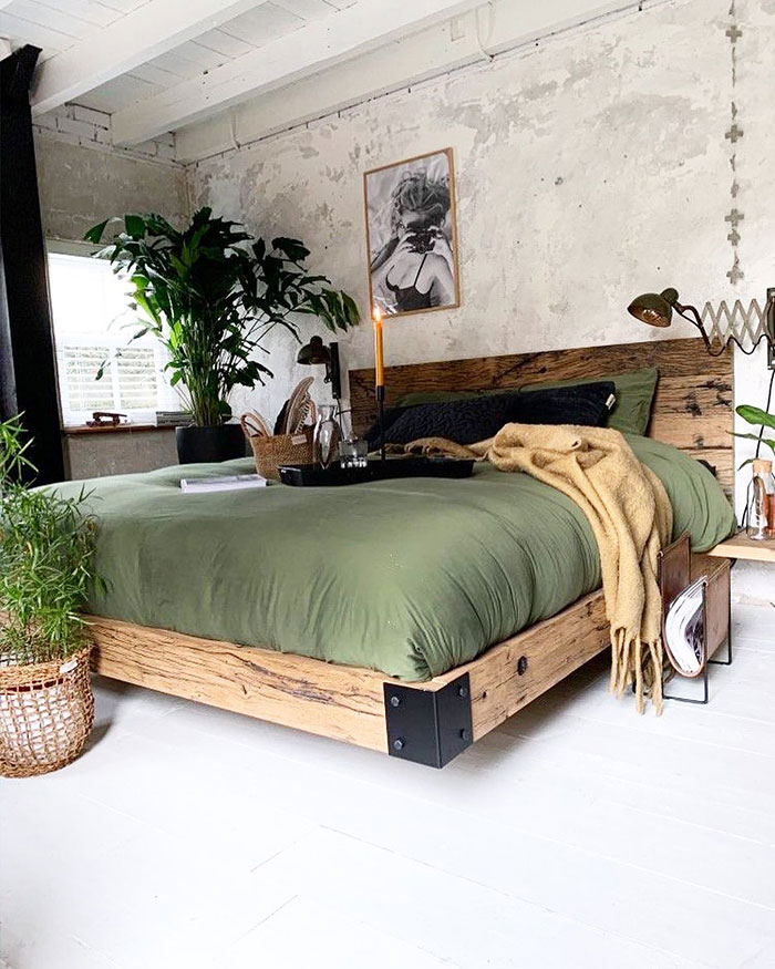 Spacious greenish industrial style master bedroom 