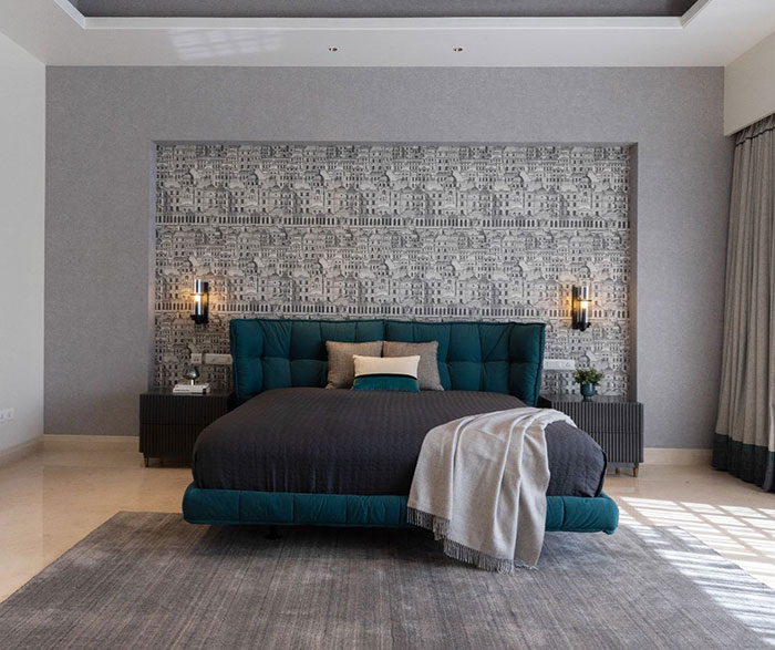 Grey master bedroom and blue bed in a room 