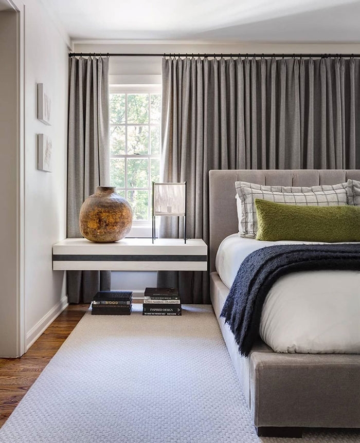 Cozy bedroom with standout grey curtains
