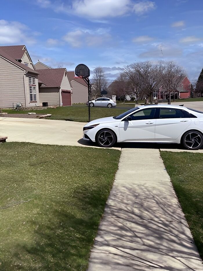 This Person Has A Three-Car Garage And A Large Driveway But Parks On The Sidewalk